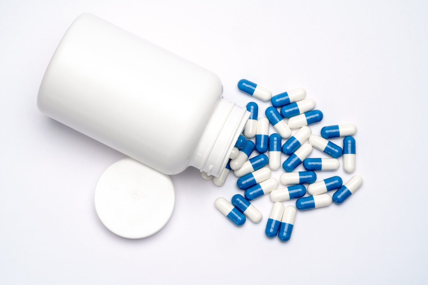 Selection of supplement forms including capsules, tablets, and softgels, highlighting Biowell Labs' expertise in contract manufacturing, private labelling, and packaging of powder, gummies, and oral liquid supplements